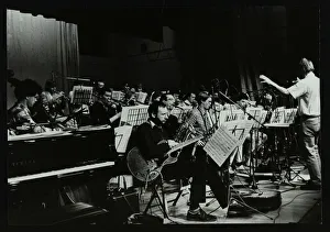 Michael Garrick conducting an orchestra at Berkhamsted Civic Centre, 1985. Artist