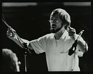 Michael Garrick conducting an orchestra at Berkhamsted Civic Centre, 1985. Artist