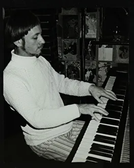 Michael Garrick playing the piano at The Bell, Codicote, Hertfordshire, 4 January 1981