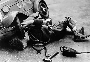 Pliers Prints: Michael Ware repairing his pedal car