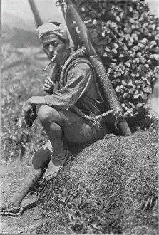 Middle-aged coolie hurriedly seated himself on the bank to pass us in review, c1900 Middle-aged coolie hurriedly seated himself on the bank to pass us in review, c1900