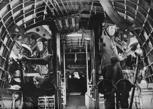 The midship gunners of an RAF flying boat alert at their stations, c1940 (1943) The midship gunners of an RAF flying boat alert at their stations, c1940 (1943)