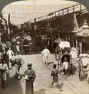 Images Dated 17th July 2008: Midsummer traffic under the awnings of Shijo Bashidori, a busy thoroughfare of Kyoto, Japan, 1904