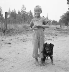 Displaced Person Gallery: Migrant boy, family, live in growers camp for... near Grants pass, Josephine County, Oregon, 1939
