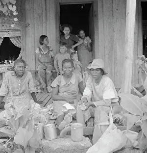 Picker Prints: Migrant cotton pickers at lunchtime, near Radstown, Texas, 1936. Creator: Dorothea Lange