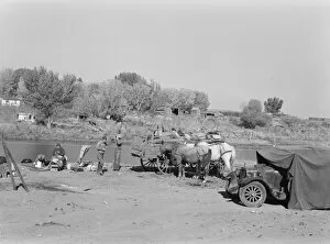 Camping Gallery: Migrant family cleaning up, near Vale, Malheur County, Oregon, 1939. Creator: Dorothea Lange