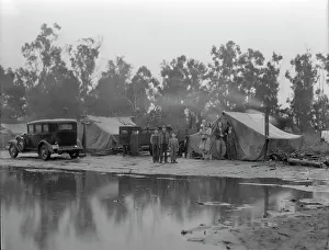 Refugee Camp Prints: Migrant pea pickers camp in the rain, California, 1936. Creator: Dorothea Lange