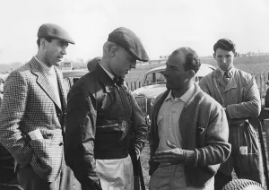 S Moss Prints: Mike Hawthorn and Stirling Moss chatting at Goodwood 1956. Creator: Unknown