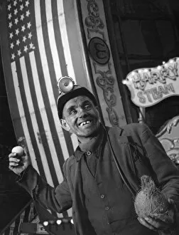 Coconut Gallery: Miner at a fairground, Conisbrough, near Doncaster, South Yorkshire, 1955. Artist