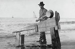 Gold Miner Prints: Miner washing gold, between c1900 and c1930. Creator: Unknown