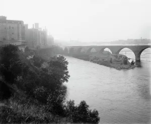 River Mississippi Prints: Minneapolis, view from across river, between 1880 and 1899. Creator: Unknown