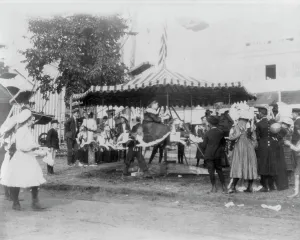 Fairground Ride Prints: Minnesota State Fair: children on small merry-go-round, 1900?. Creator: Unknown