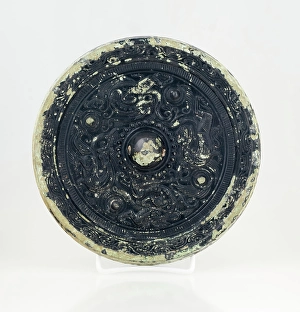 Ageing Prints: Mirror with dragon and tiger design, 0-199. Creator: Unknown