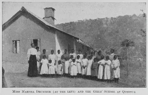 Angola Prints: Miss Martha Drummer [at the left] and the Girls School at Quessua, 1922. Creator: Unknown