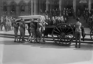 Transporting Prints: Mitchel Funeral, 1918. Creator: Bain News Service