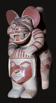Mochica stirrup-spout vessel of a male figure with a jaguars head, 3rd century