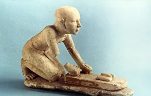 Baking Prints: Model of a baker kneading dough and forming loaves, Ancient Egyptian