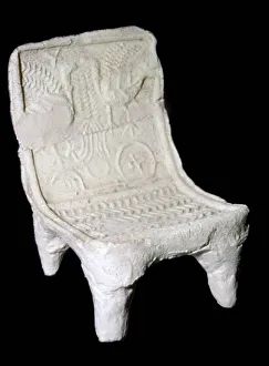 Model terracotta chair from Ur with relief design of two birds