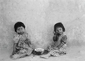 Melons Prints: Moki melon eaters, c1900. Creator: Edward Sheriff Curtis