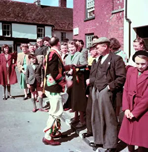 Tradition Dress Prints: Morris man talking to onlookers, c1955. Creator: Arthur Charles Kirby Ware