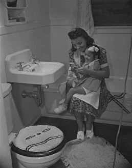 Washing Collection: Mother and her daughter, Frederick Douglass housing project, Anacostia, D.C. 1942