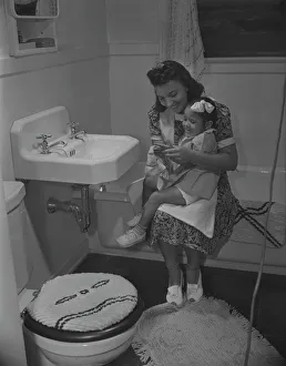 Washing Prints: Mother and her daughter, Frederick Douglass housing project