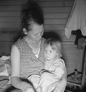 Healthcare Collection: Mother from Oklahoma, awaits visit of resident nurse for sick baby, FSA camp, Farmersville, CA
