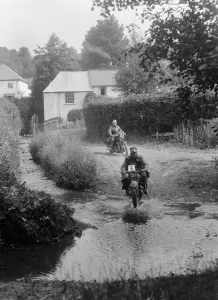 Motorcycling Prints: Motorcycles competing in the B&HMC Brighton-Beer Trial, Windout Lane, near Dunsford