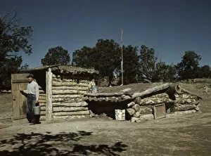 Basement Collection: Mr. Leatherman, homesteader, coming out of his dugout home, Pie Town, New Mexico, 1940