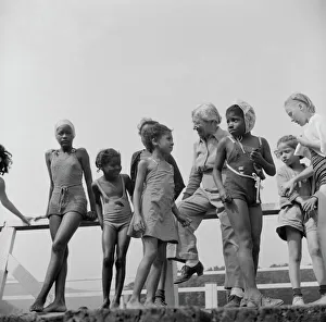 Haverstraw, New York. Interracial activities at Camp Christmas Seals, where children are aided by the Methodist Camp Service. Mrs. Addie C. Cox, director, giving instruction to the campers before the swim Teens Gallery: Mrs. Addie C. Cox, director, Camp Christmas Seals, Haverstraw, New York, 1943. Creator: Gordon Parks