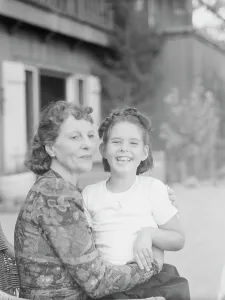 Mrs. Churchill with child Orrin, seated outdoors, not before 1932 Mar. Creator: Arnold Genthe