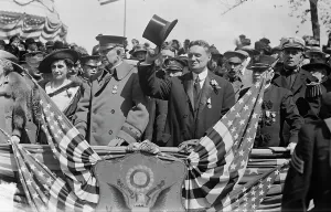 Podium Prints: Mrs. C.S. Whitman, Gen. J.F. Bell, Gov. Whitman, 1917. Creator: Bain News Service