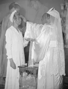 Mrs. Ella Watson, a government charwoman, receiving annointment... Washington, D.C. 1942. Creator: Gordon Parks