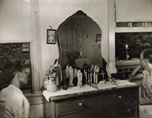 Dressing Table Collection: Mrs. Ella Watson, a government charwoman and her adopted daughter, Washington, D.C. 1942