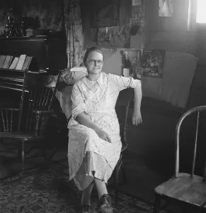 Mrs. Hull in one-room dugout basement home, Dead Ox Flat, Malheur County, Oregon, 1939. Creator: Dorothea Lange