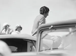 Mrs. Jack Bouvier, seated on a car, 1932. Creator: Arnold Genthe