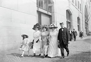 Mrs. Mills, Mrs. Hyde, Mrs. Ginnett, a detective and a little girl walking down the street... 1910. Creator: Bain News Service