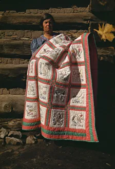 Mrs. Bill Stagg with state quilt which she made, Pie Town, New Mexico, 1940. Creator: Russell Lee