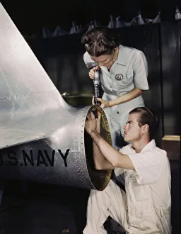 Mrs. Virginia Davis, a riveter in the assembly and repair department of the Naval Air Base... 1942. Creator: Howard Hollem
