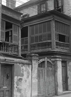 Multi Storey Prints: Multi-story house behind wall with gate