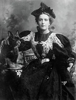 Bull Dog Prints: Natalie Barney seated with dog, 1910. Creator: Bain News Service
