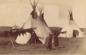 Native American Woman in Camp with Racks of Drying Meat, 1880s-90s. Creator: Unknown Native American Woman in Camp with Racks of Drying Meat, 1880s-90s. Creator: Unknown