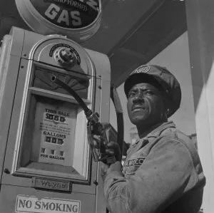 Filling Station Prints: Negro mechanic for the Amoco oil company, Washington, D. C. 1942. Creator: Gordon Parks
