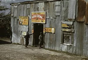 Beer Gallery: Negro migratory workers by a 'juke joint'(?), Belle Glade, Fla. 1941. Creator: Marion Post Wolcott