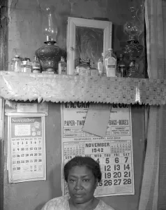 Calendar Gallery: Negro woman in her home, Washington (southwest section), D.C. 1942. Creator: Gordon Parks