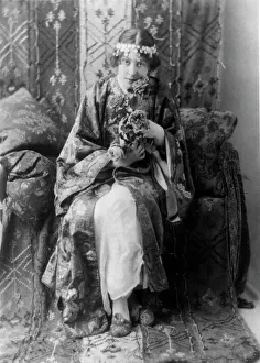 Neith Boyce Hapgood, full-length portrait, seated facing front, wearing... between 1890 and 1910. Creator: Frances Benjamin Johnston