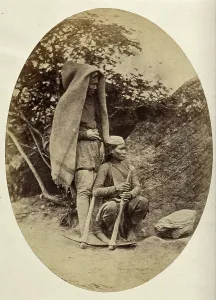 Crouching Prints: Nepal: two Tibetan men with pick-axes, c1860. Creator: Clarence Comyn Taylor