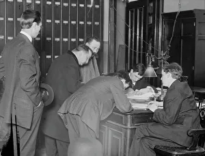 Paperwork Prints: New citizens signing naturalization papers in judge's chambers