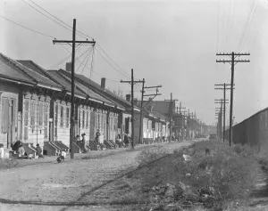 Rowhouse Prints: New Orleans Negro street, Louisiana, 1935. Creator: Walker Evans