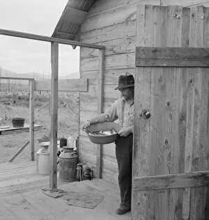 Milk Gallery: New settler shows fish he caught this morning, Priest River Valley, Bonner County, Idaho, 1939